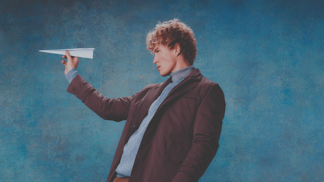 Image of a men with paper plane